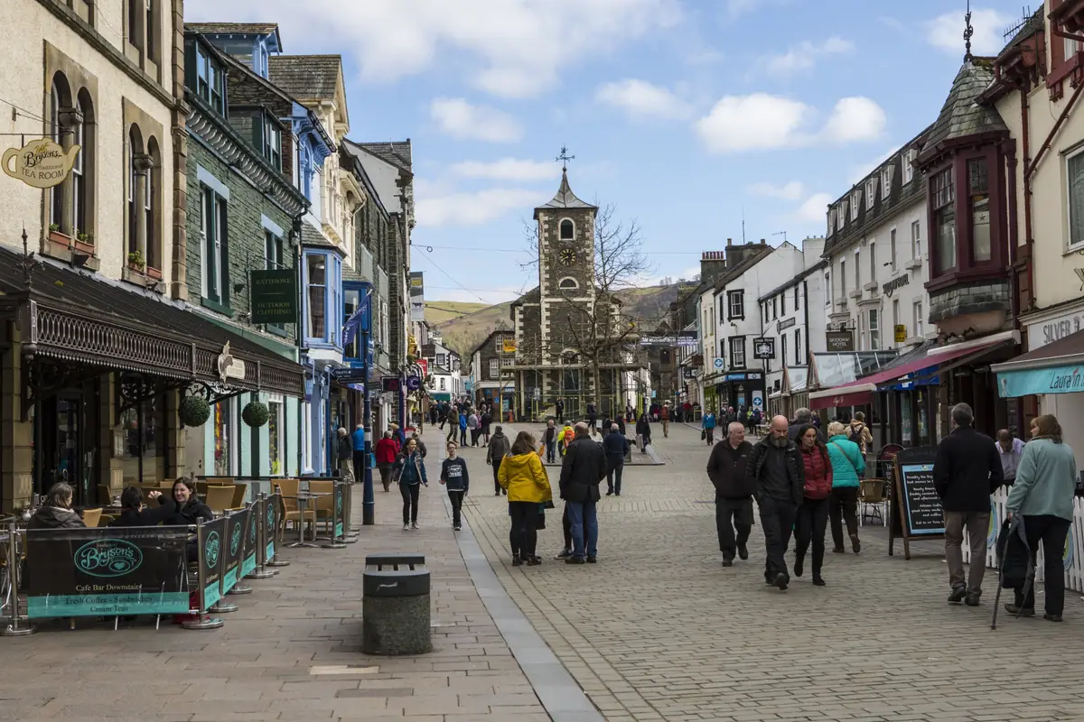 Keswick Main Street and the Moot Hall clock tower, with the fells beyond