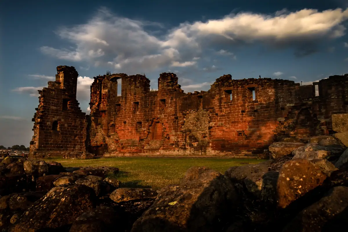 The red sandstone ruins of Penrith Castle at sunset